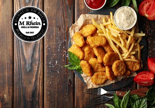 Hähnchen Nuggets 12 Stk. mit Pommes
