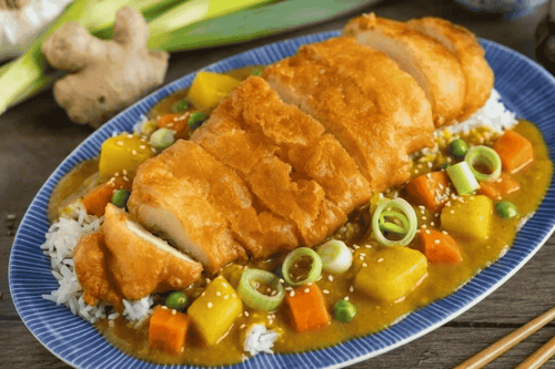 60. Hühnerbrustfilet im Teigmantel mit rotem Curry (scharf)