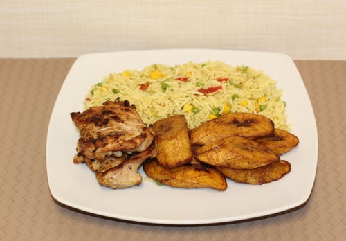 Fried rice with chicken thigh fillet and plantain